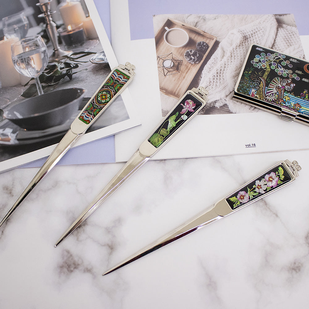 "Korean mother-of-pearl letter opener with traditional patterns"